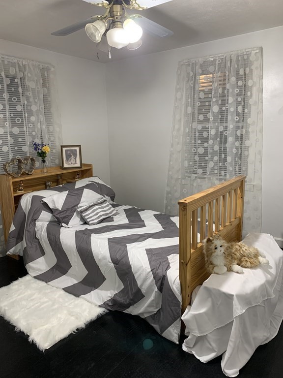 23 Notre Dame Street Springfield, MA 01104 - Photo 6 of 28 a bedroom with a bed and window