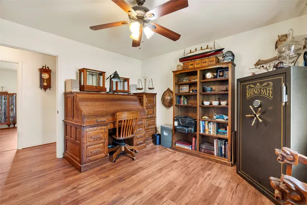 a view of a livingroom with furniture and a window