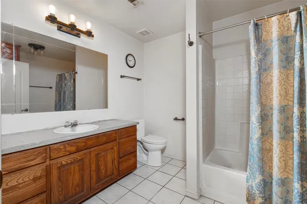 a view of a workspace with furniture and wooden floor