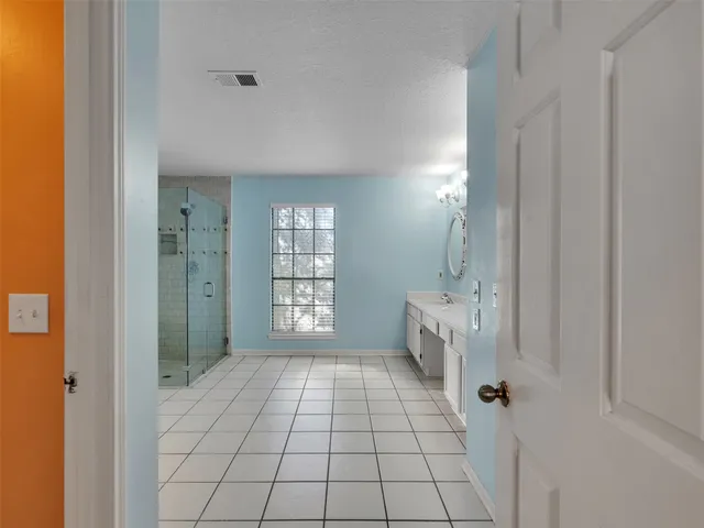 a view of an empty room with a window