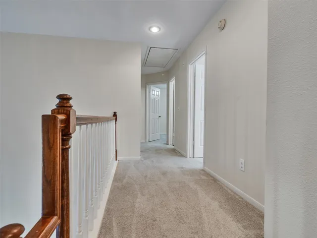 a view of a hallway with a room