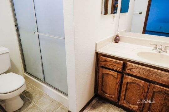 420 Veada Avenue Ridgecrest, CA 93555 - Photo 24 of 41 a bathroom with a sink and a toilet