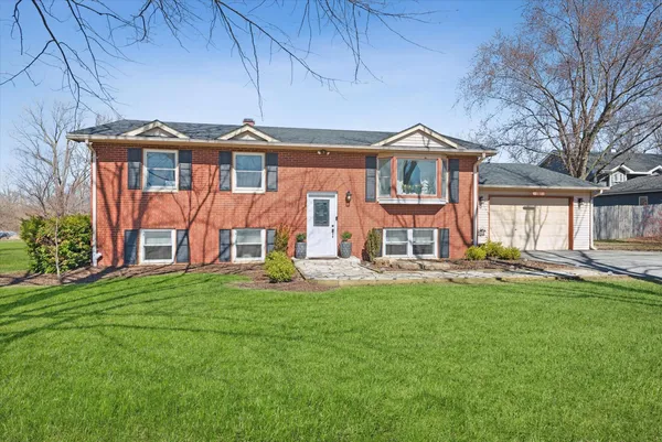 front view of a house with a yard