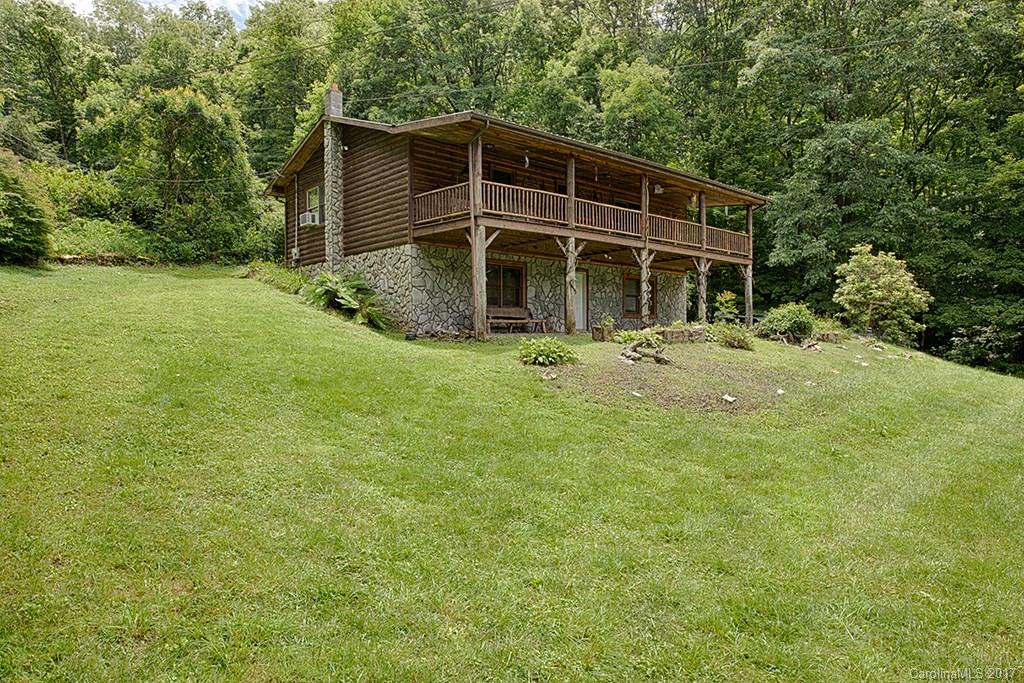 95 Straightup Road Maggie Valley, NC 28751 - Photo 2 of 24 a front view of a house with a yard
