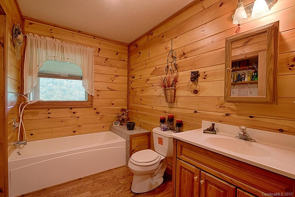 95 Straightup Road Maggie Valley, NC 28751 - Photo 14 of 24 a bathroom with a sink toilet and shower
