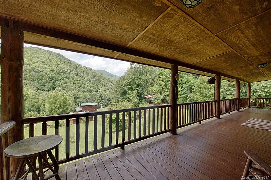 95 Straightup Road Maggie Valley, NC 28751 - Photo 18 of 24 a view of a wooden deck and a backyard