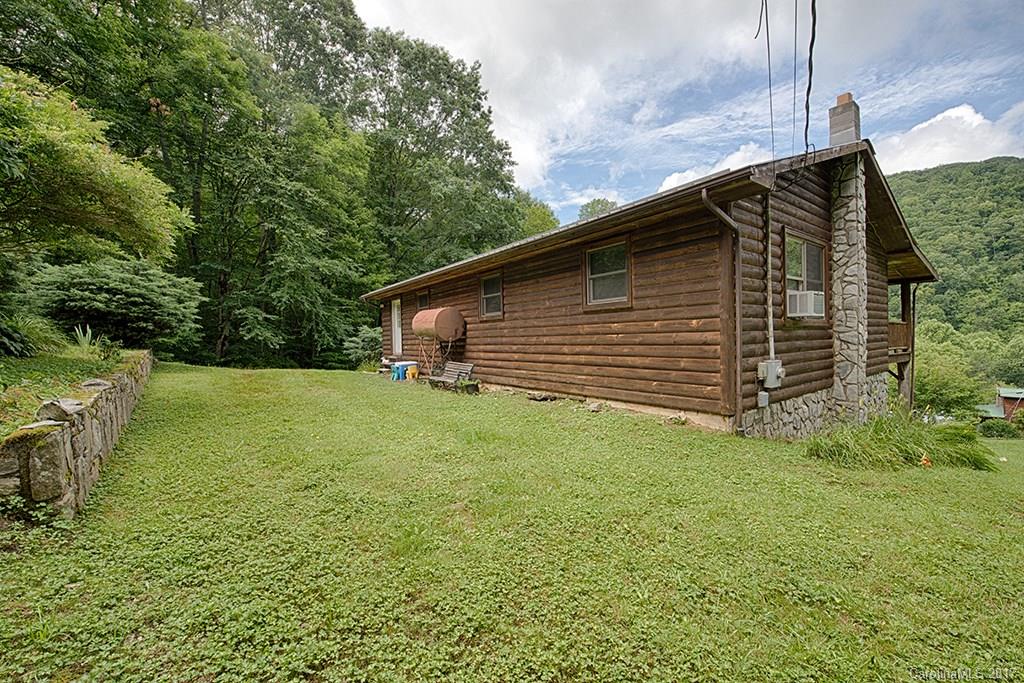 95 Straightup Road Maggie Valley, NC 28751 - Photo 19 of 24 a backyard of a house with lots of green space