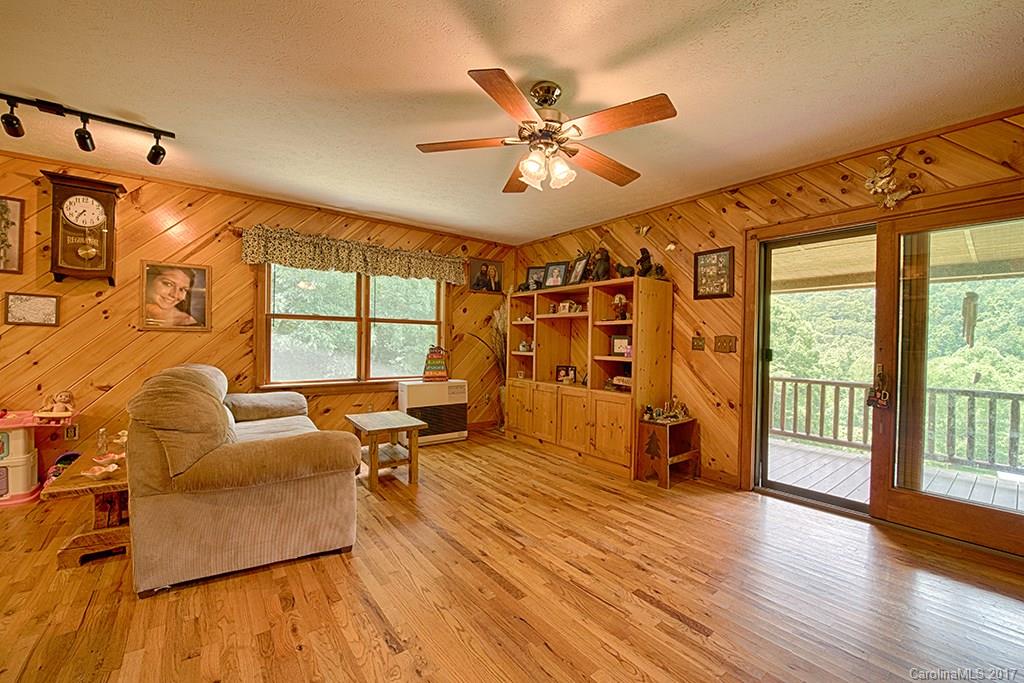 95 Straightup Road Maggie Valley, NC 28751 - Photo 6 of 24 a living room with furniture and a large window