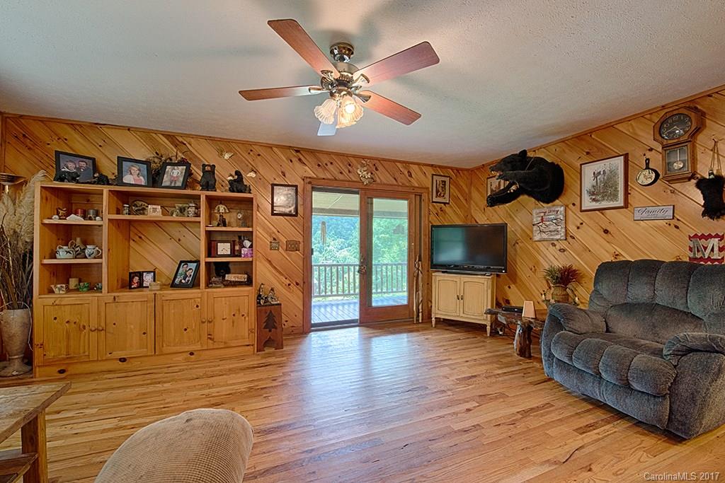 95 Straightup Road Maggie Valley, NC 28751 - Photo 7 of 24 a living room with furniture and a flat screen tv