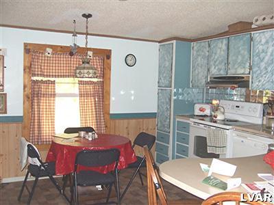 415 Roberts Road Effort, PA 18330 - Photo 2 of 5 a dining room with furniture a chandelier and window