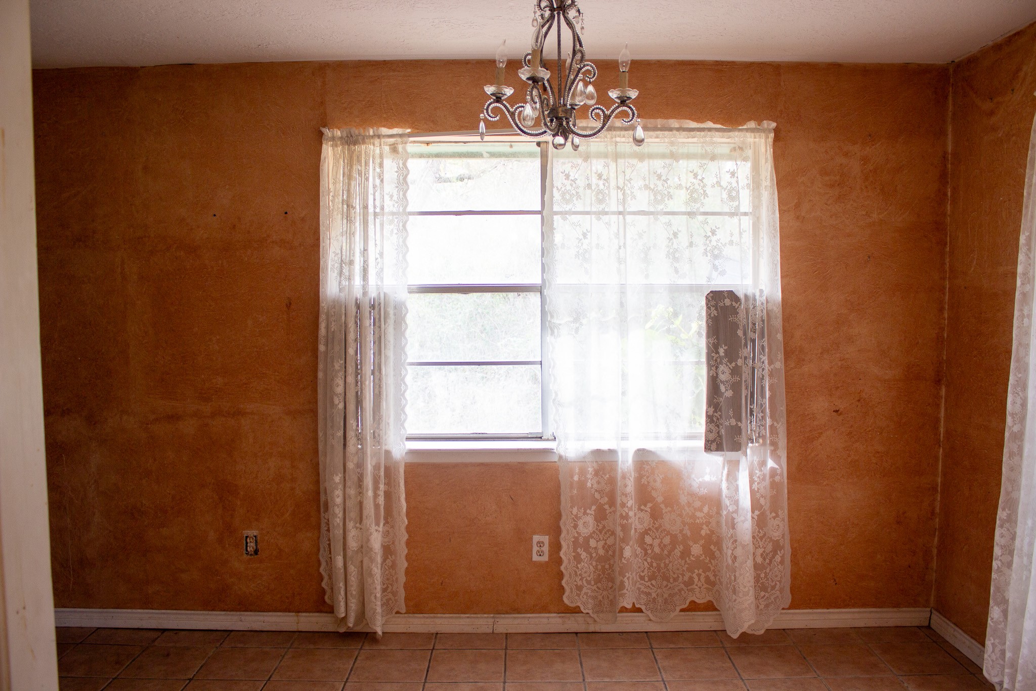 24765 Wicklow Road Hempstead, TX 77445 - Photo 23 of 29 a view of a windows and chandelier in an empty room