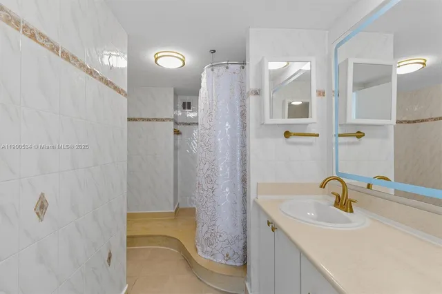 a bathroom with a sink and mirror