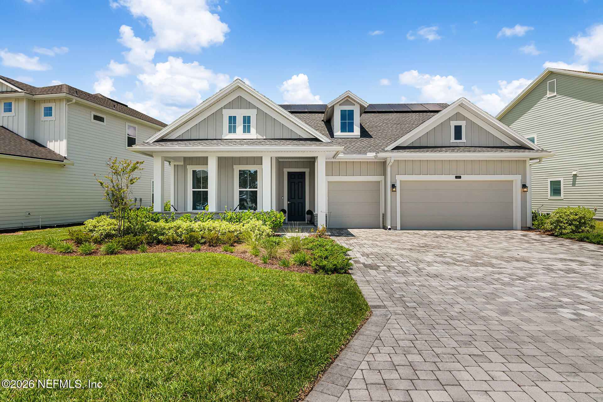 637 Navigators Road St. Johns, FL 32259 - Photo 1 of 42 a front view of a house with a yard and potted plants