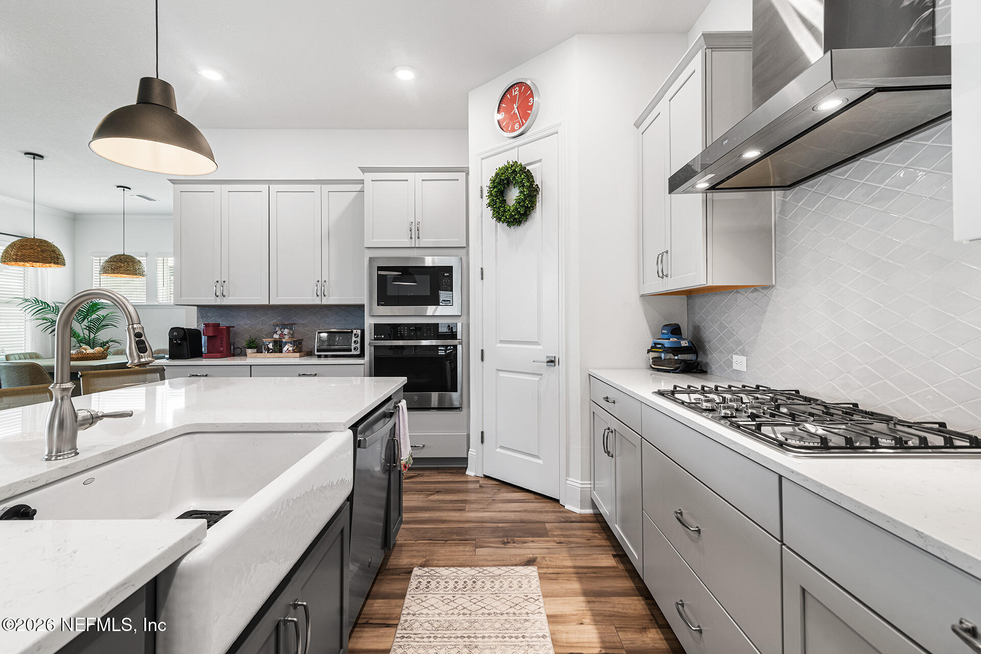 637 Navigators Road St. Johns, FL 32259 - Photo 11 of 42 a kitchen with stainless steel appliances kitchen island granite countertop a sink and cabinets