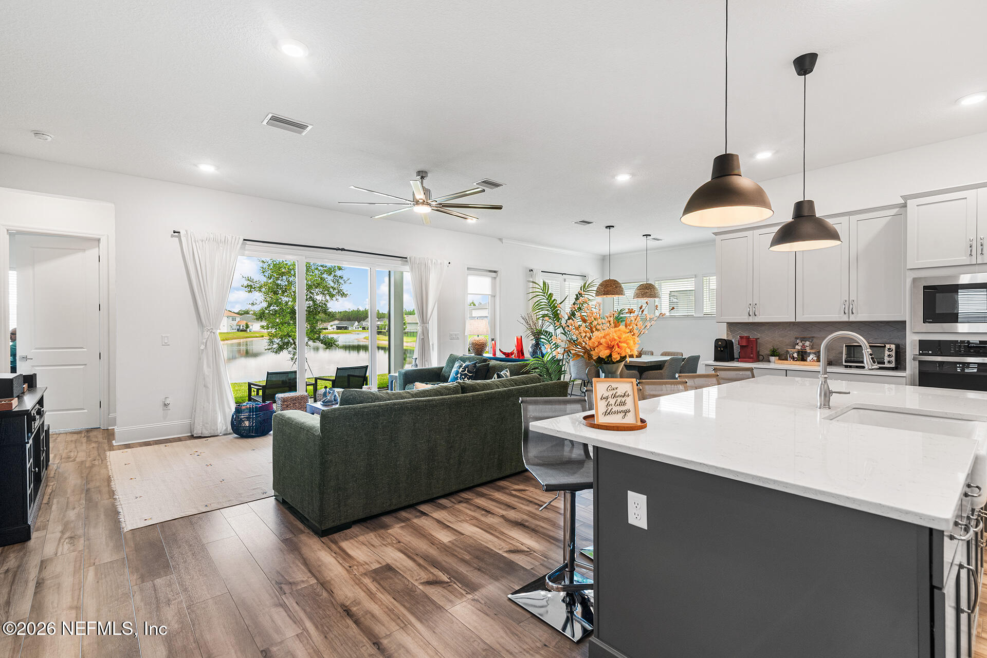 637 Navigators Road St. Johns, FL 32259 - Photo 12 of 42 a kitchen with stainless steel appliances kitchen island a large island in the center