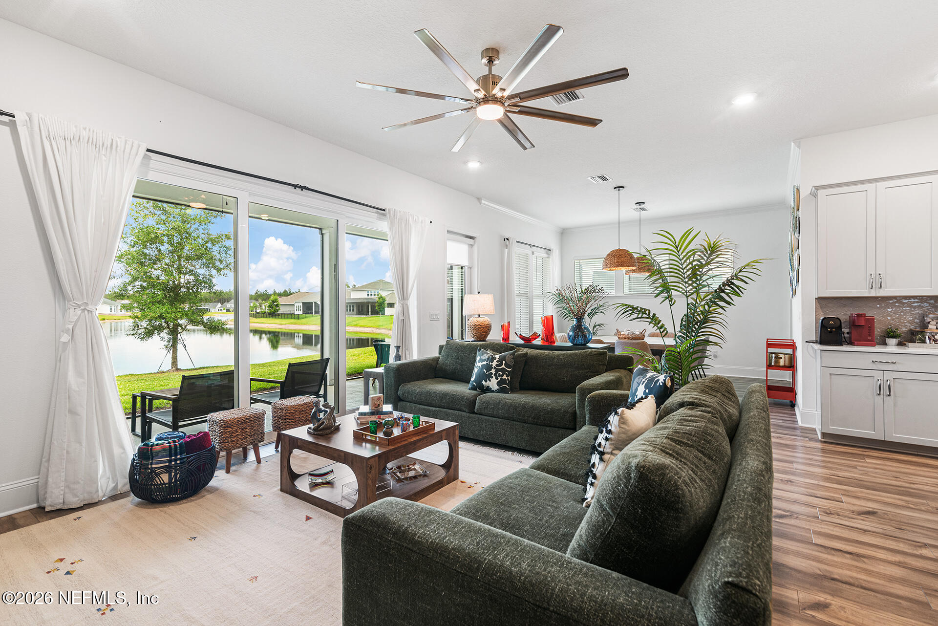 637 Navigators Road St. Johns, FL 32259 - Photo 13 of 42 a living room with furniture and a large window with garden view