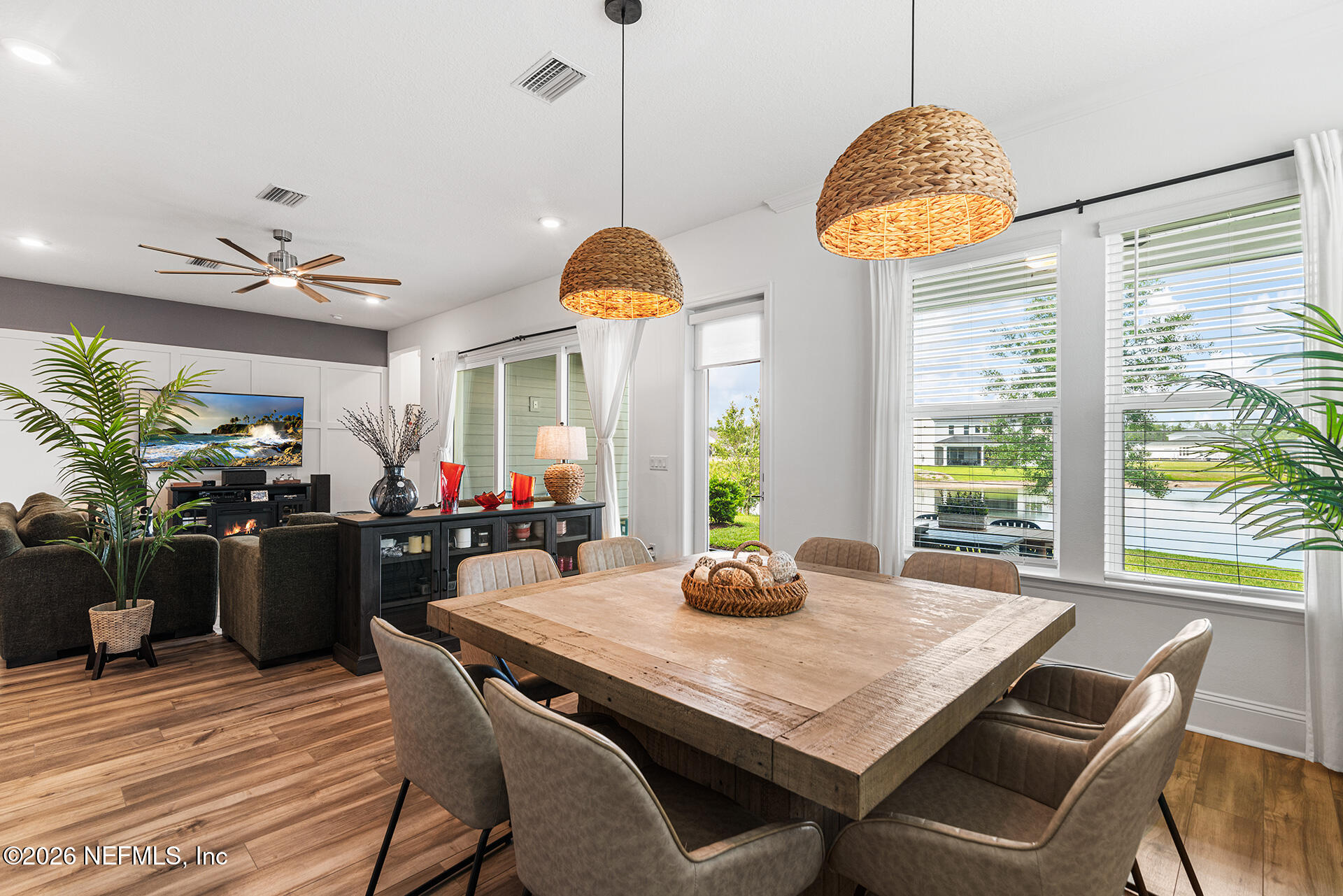 637 Navigators Road St. Johns, FL 32259 - Photo 18 of 42 a view of a dining room and livingroom with furniture wooden floor a chandelier
