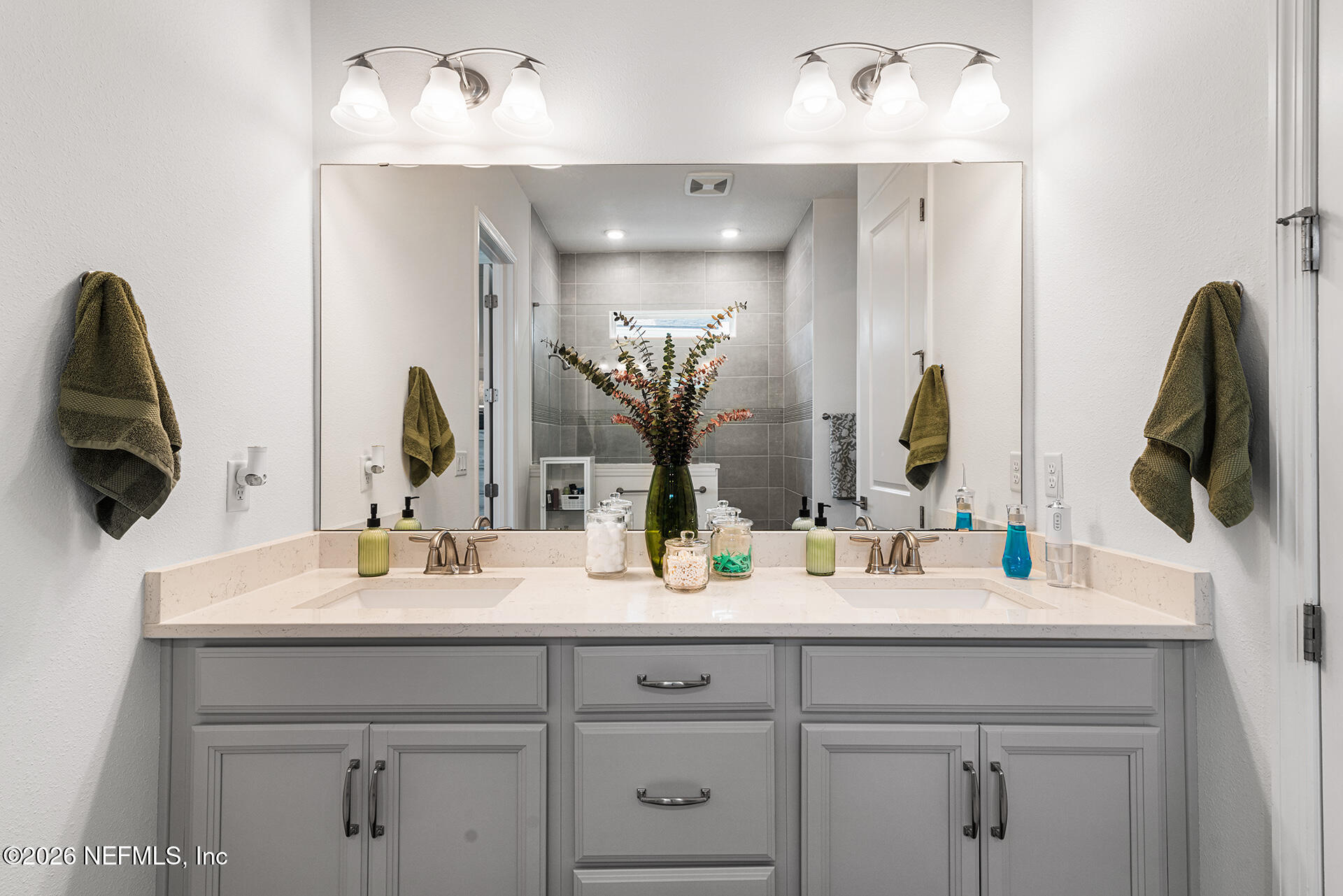 637 Navigators Road St. Johns, FL 32259 - Photo 22 of 42 a bathroom with a double vanity sink and a mirror