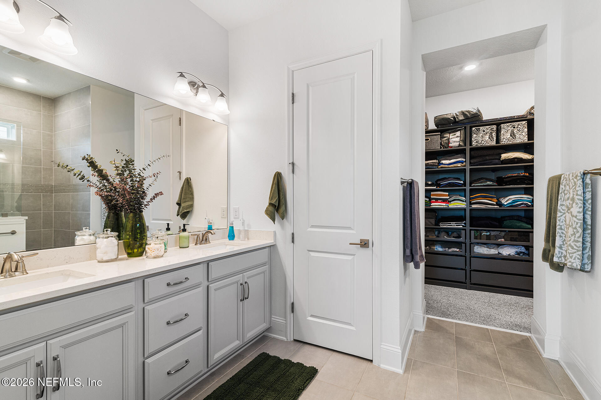 637 Navigators Road St. Johns, FL 32259 - Photo 23 of 42 a bathroom with a double vanity sink mirror and shower