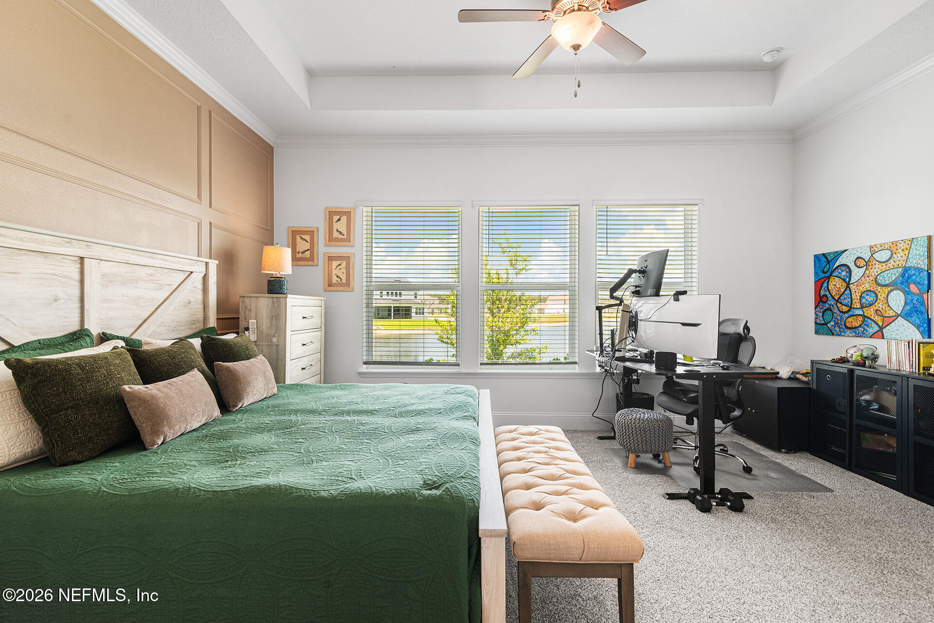 637 Navigators Road St. Johns, FL 32259 - Photo 41 of 42 a bedroom with a bed a desk and chair with wooden floor