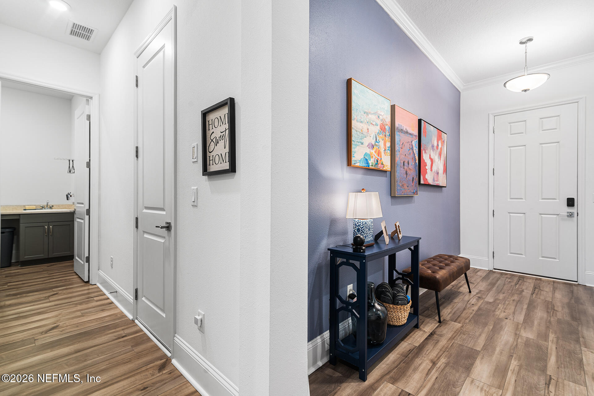 637 Navigators Road St. Johns, FL 32259 - Photo 6 of 42 a view of a hallway and a livingroom with furniture