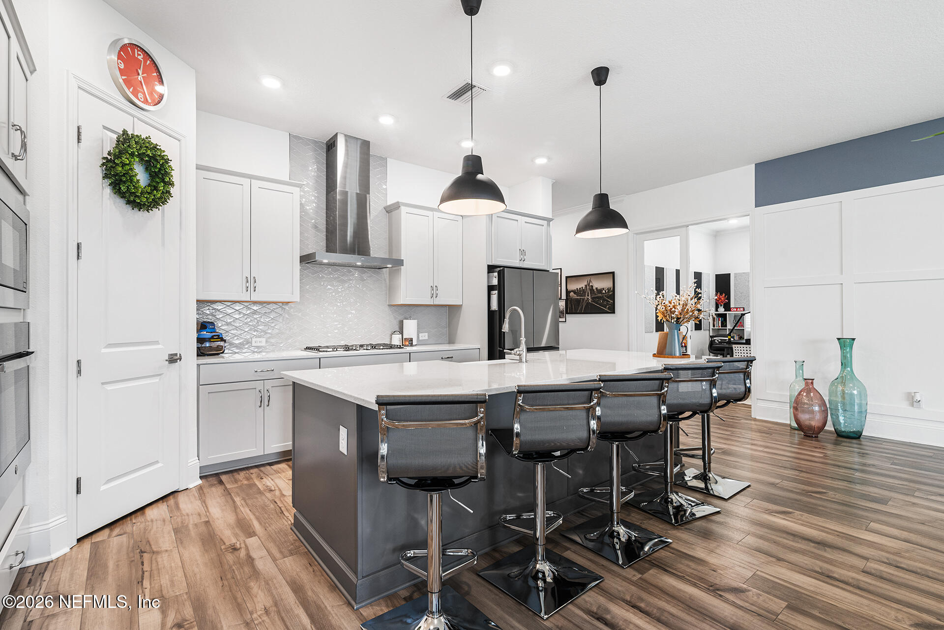 637 Navigators Road St. Johns, FL 32259 - Photo 10 of 42 a kitchen with stainless steel appliances granite countertop a dining table chairs sink and cabinets