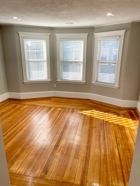 1 Ropes Street, Unit 2 Salem, MA 01970 - Photo 8 of 16 a view of an empty room with window and wooden floor