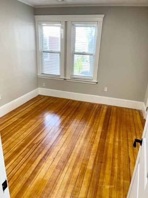 1 Ropes Street, Unit 2 Salem, MA 01970 - Photo 9 of 16 a view of an empty room with wooden floor and a window