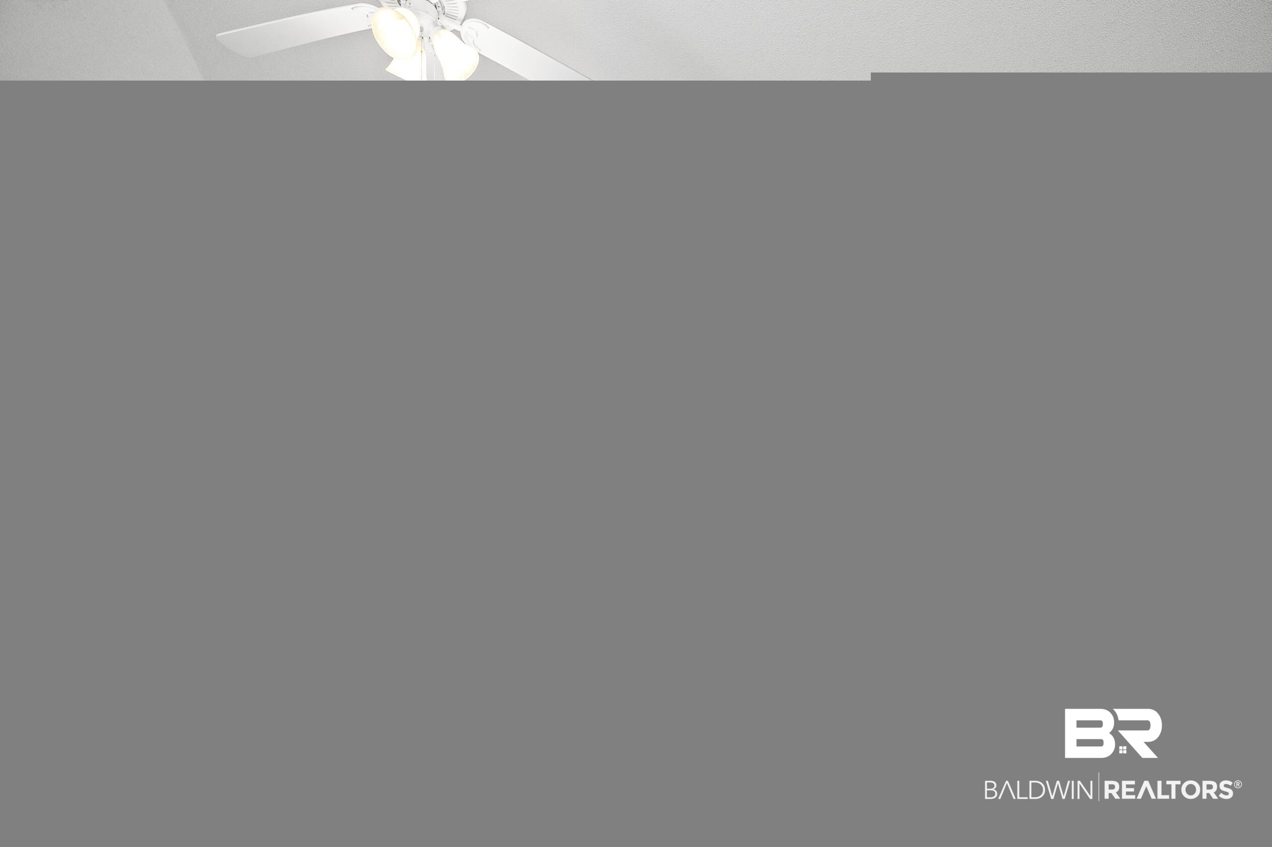 306 Monteith Oaks Drive Foley, AL 36535 - Photo 6 of 38 Unfurnished living room featuring dark wood-style flooring, a chandelier, vaulted ceiling, and a ceiling fan