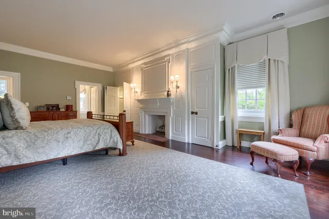 a view of a patio with table and chairs with wooden floor and fence