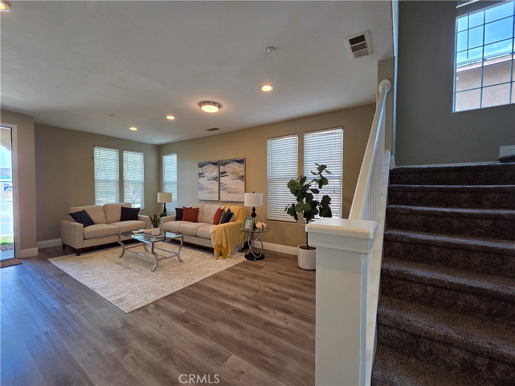 20329 Red Poppy Lane Riverside, CA 92508 - Photo 7 of 24 a living room with furniture and a potted plant
