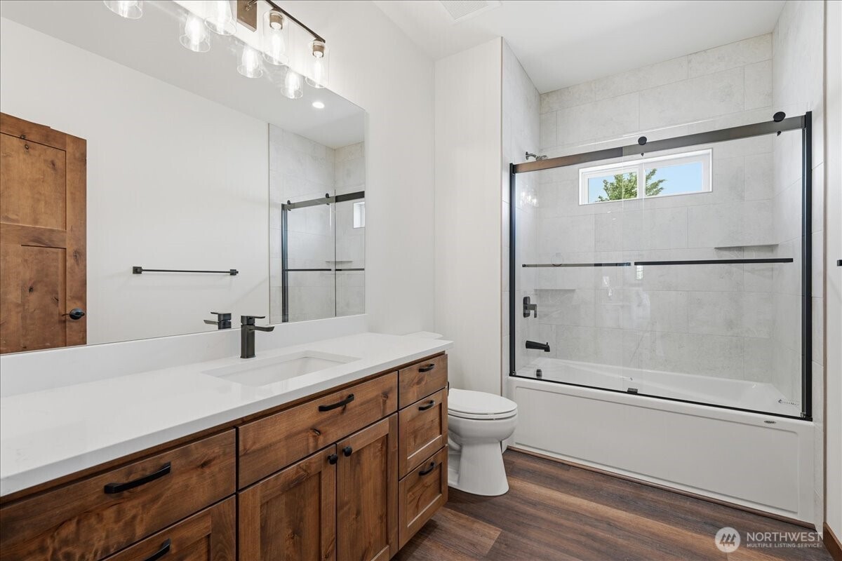 110 Slide View Lane Manson, WA 98831 - Photo 31 of 38 a bathroom with a granite countertop sink mirror and toilet