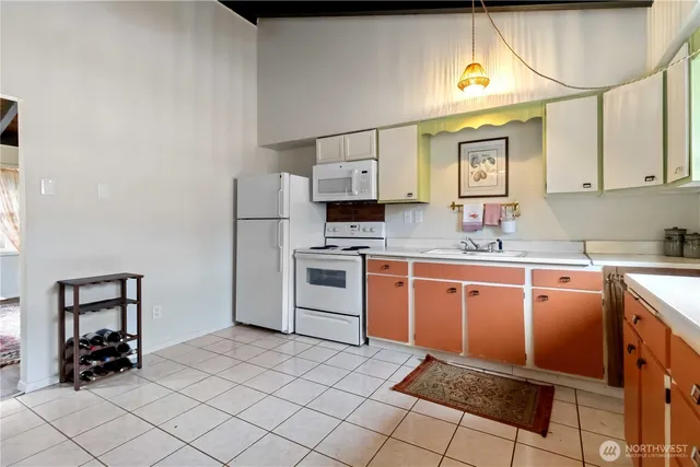 a kitchen with stainless steel appliances granite countertop a sink and cabinets