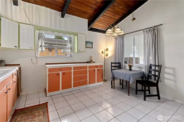 a dining room with furniture and window