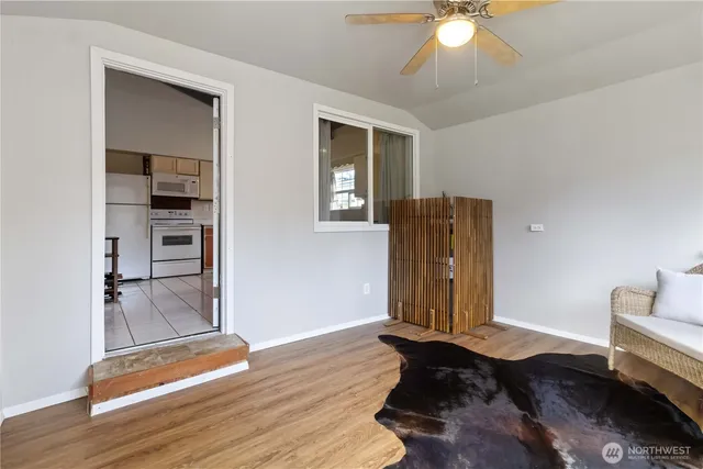 a view of room with wooden floor and window