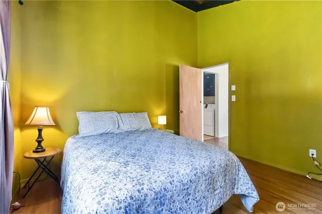 a bedroom with a bed and lamps
