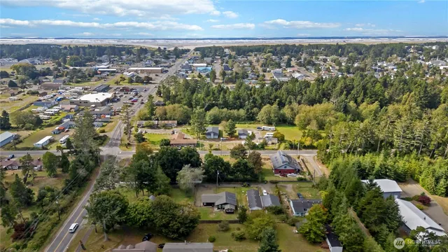 an aerial view of residential building with green space
