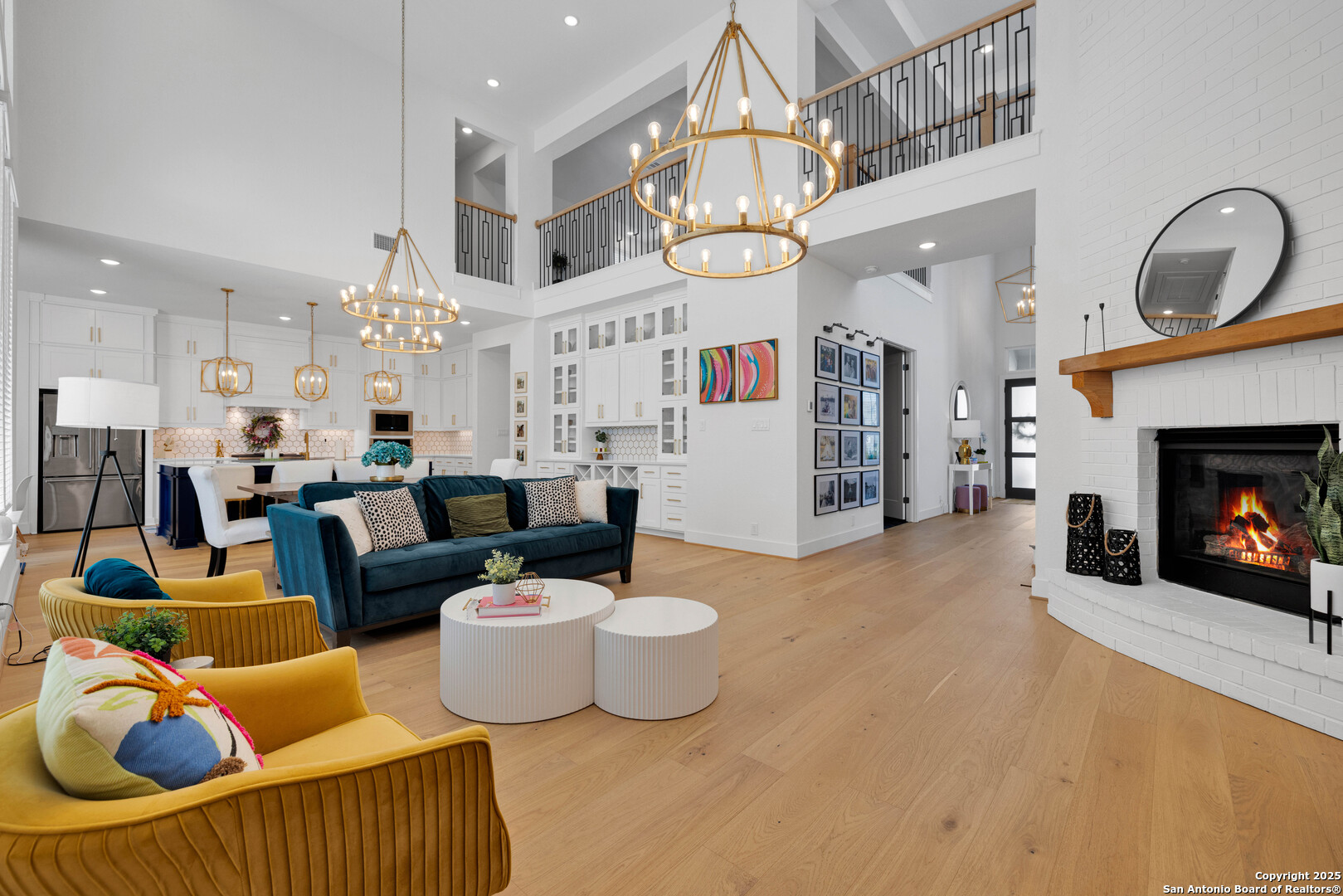 235 Corazon Boerne, TX 78006 - Photo 16 of 68 a living room with furniture a fireplace and a chandelier