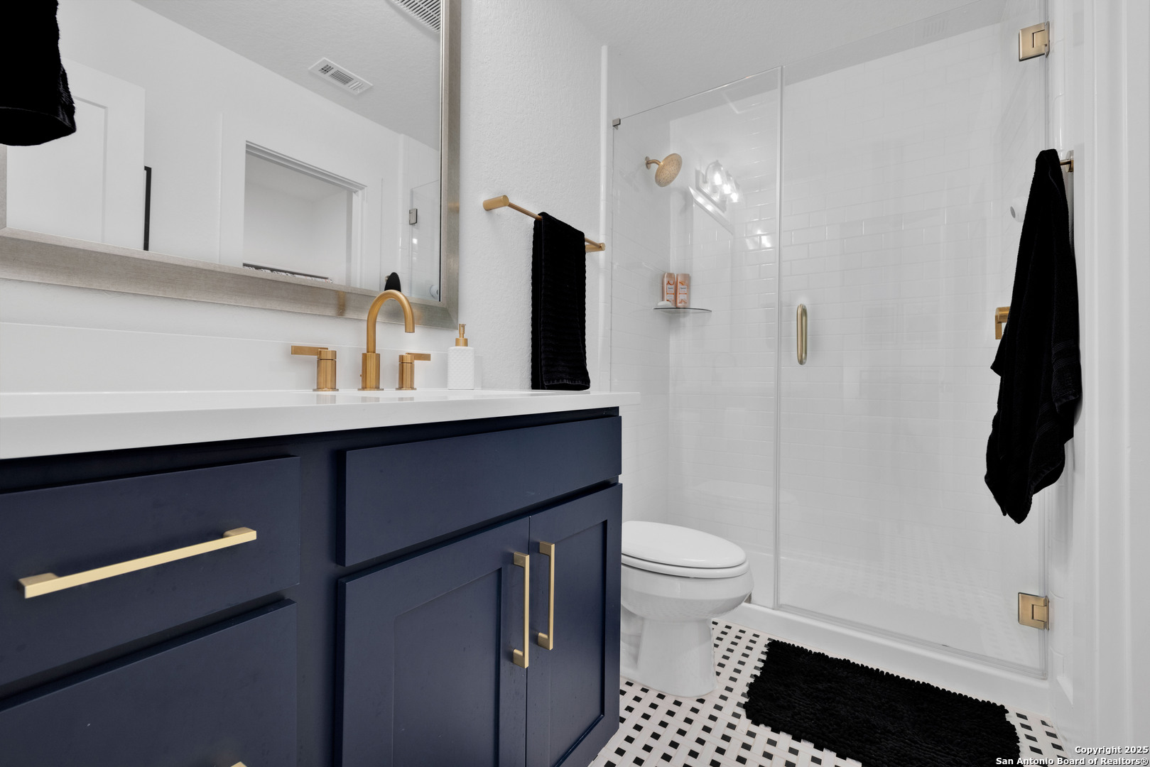 235 Corazon Boerne, TX 78006 - Photo 50 of 68 a bathroom with a sink a toilet a mirror and shower