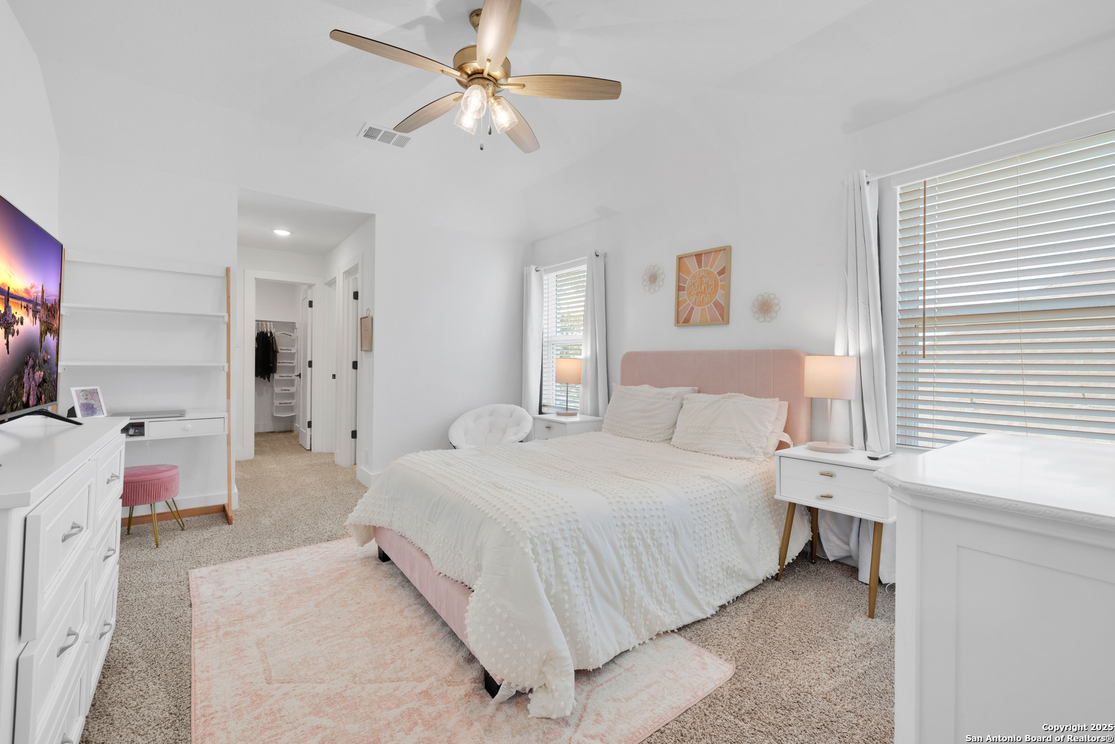 235 Corazon Boerne, TX 78006 - Photo 51 of 68 a bedroom with a bed and a chandelier