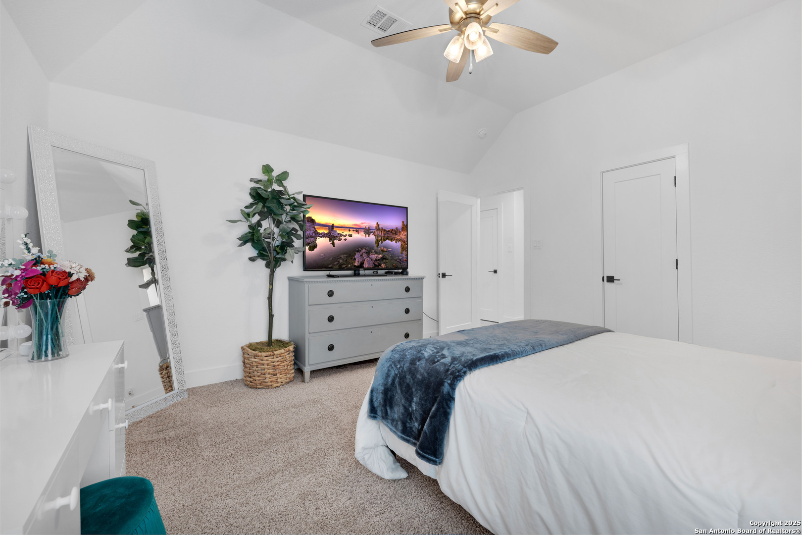 235 Corazon Boerne, TX 78006 - Photo 55 of 68 a spacious bedroom with a bed and a flat screen tv