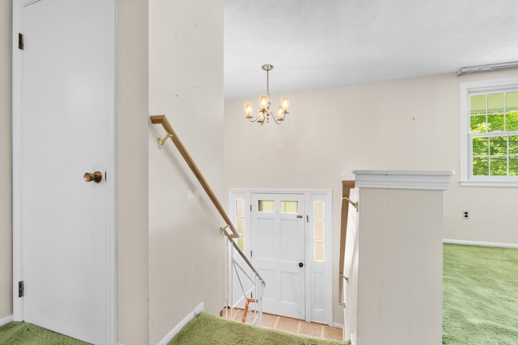 348 Belknap Road Framingham, MA 01701 - Photo 22 of 35 a view of a hallway with windows and stairs