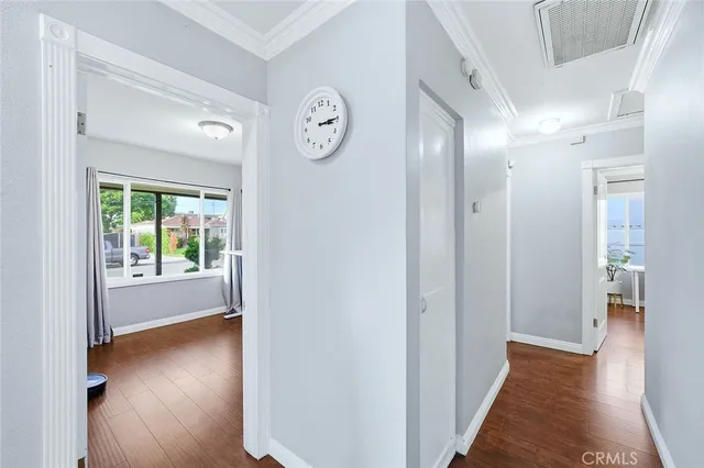 a view of hallway with wooden floor