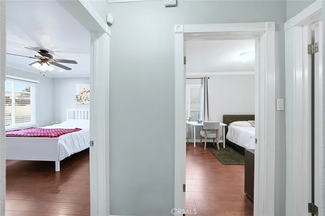 a en suite bathroom with a granite countertop sink and a mirror