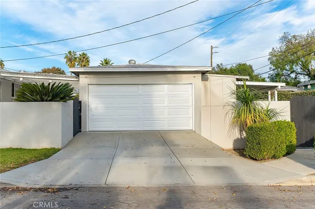 an aerial view of a house with a lake view