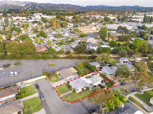 an aerial view of a house with a swimming pool