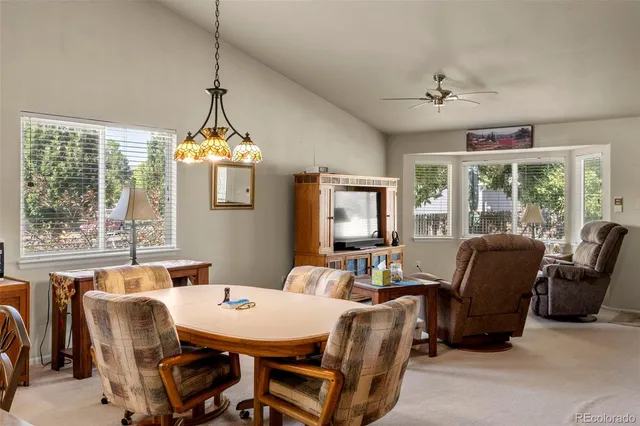 a view of a dining room with furniture window and outside view
