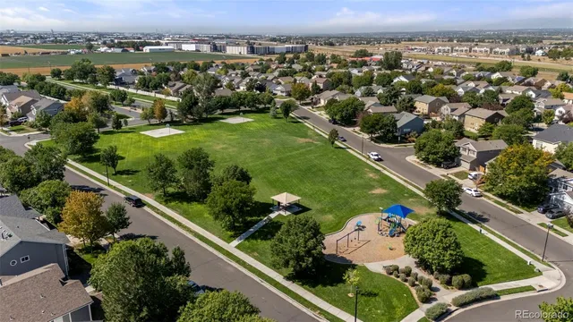 an aerial view of lake and residential houses with outdoor space