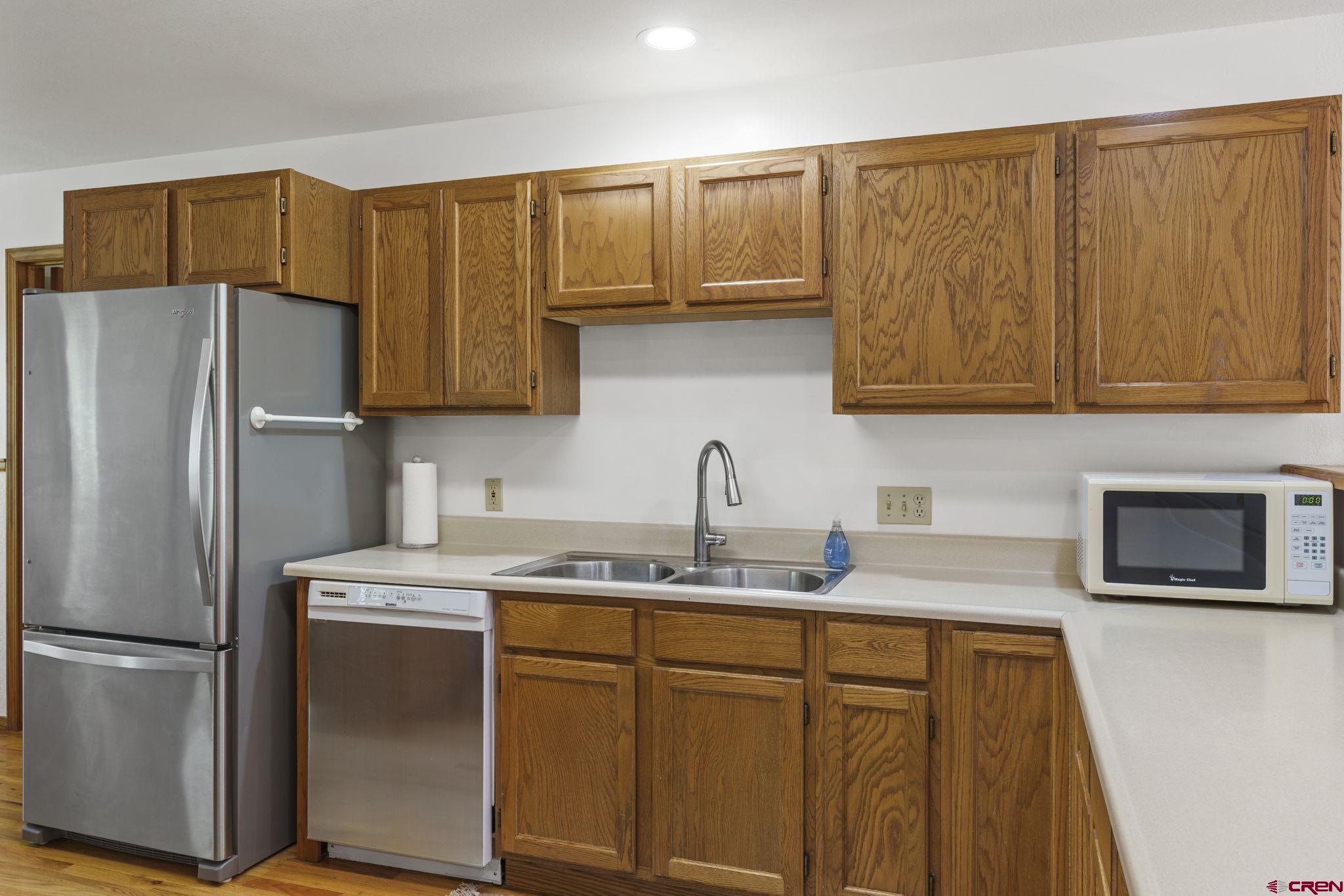 37 Verde Lane Durango, CO 81301 - Photo 14 of 45 a kitchen with stainless steel appliances granite countertop a refrigerator sink and microwave