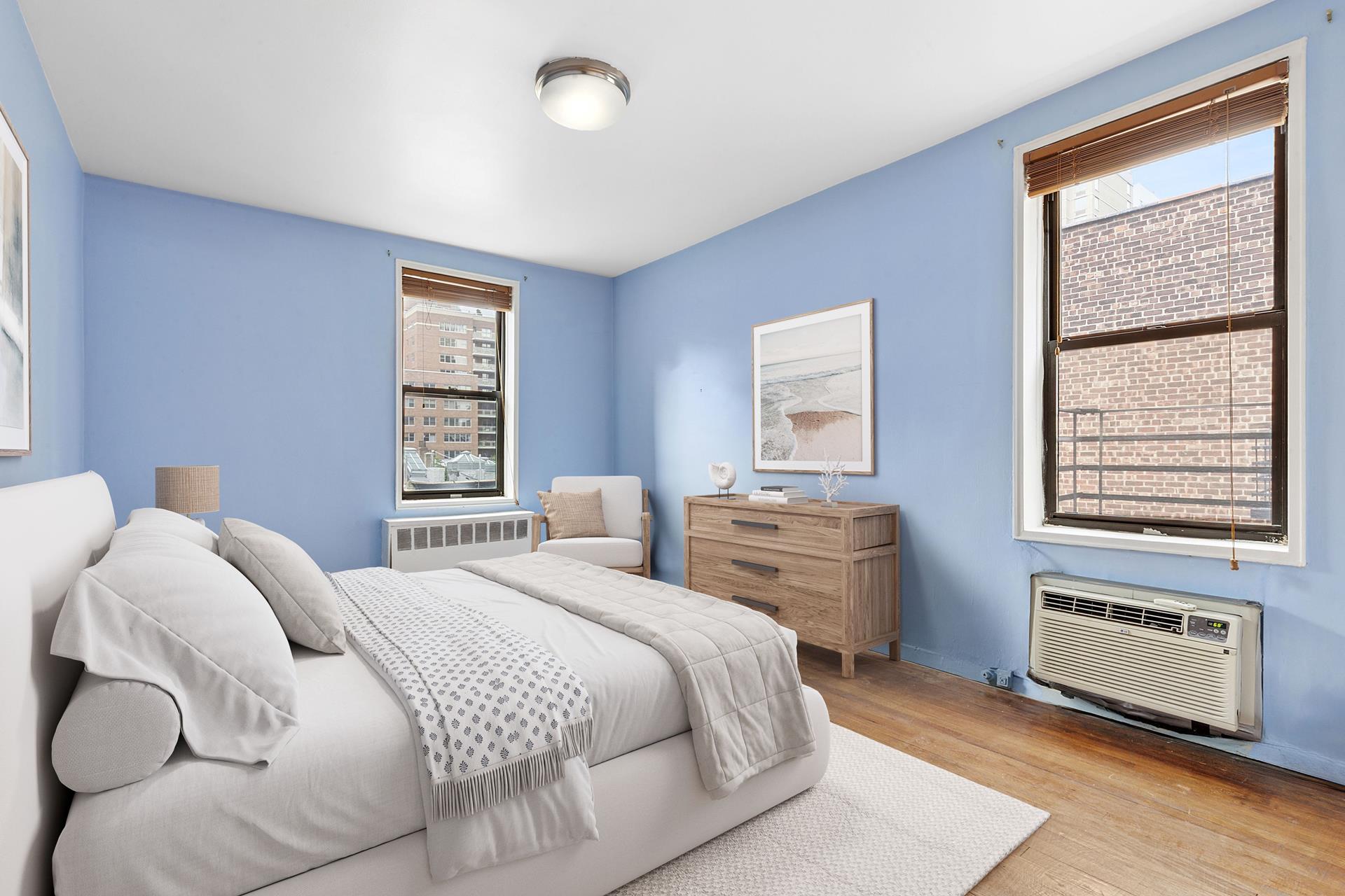 330 East 70th Street, Unit 6E Manhattan, NY 10021 - Photo 3 of 9 a bedroom with a bed and a window